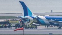 A JetBlue flight that rolled into grass next to the runway at Logan International Airport on June 12, 2025.