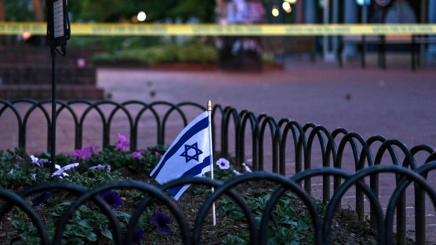 An Israeli flag stands in a bed of flowers as caution tape blocks off a deserted Pearl Street on the scene of an attack on demonstrators calling for the release of Israeli hostages held in Gaza, in Boulder, Colorado, on June 1, 2025. Several people suffered burns and other injuries June 1st in the US state of Colorado in what the FBI called a “targeted terror attack” against demonstrators seeking the release of Israeli hostages held in Gaza.
Police in the city of Boulder said a man was taken into custody. They were more cautious in presuming a possible motive for the attack, which multiple sources said was committed against members of the Jewish community during a peaceful gathering. (Photo by Eli Imadali / AFP) (Photo by ELI IMADALI/AFP via Getty Images)