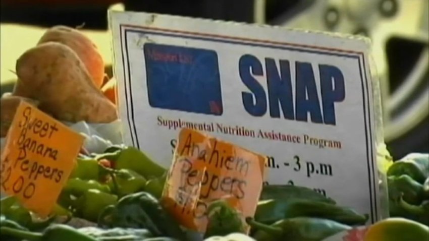 A sign near food at a grocery story that says "SNAP."