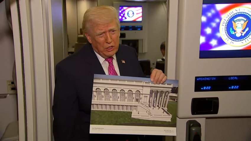 Donald Trump holds up mock up of White House ballroom during gaggle on Air Force One