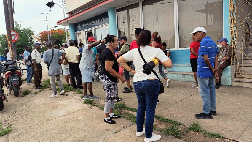HAVANA, CUBA – JUNE 4: Citizens wait in front of a bank since Central Bank of Cuba said the country will no longer process Visa and Mastercard payments following a foreign bank handling these transactions ended its relationship with FINCIMEX S.A., in Havana, Cuba, on June 4, 2026. Consequently, the country will be unable to accept payments for goods and services made with these international cards. (Photo by Angelo Mastrascusa/Anadolu via Getty Images)