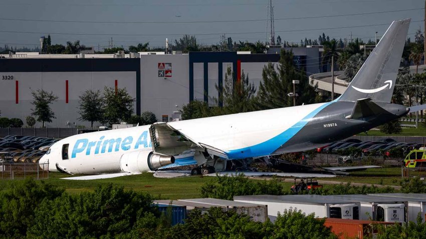 An Amazon cargo plane crashed after overshooting the runway at Miami International Airport (MIA) in Miami, Florida, US, on Sunday, Sept. 6, 2026. The Boeing 767-300, operated by 21 Air as Prime Air Flight 7598, overshot the runway and burst into flames on Sunday, killing at least five people and shutting down the airport’s runways. Photographer: Eva Marie Uzcategui/Bloomberg via Getty Images